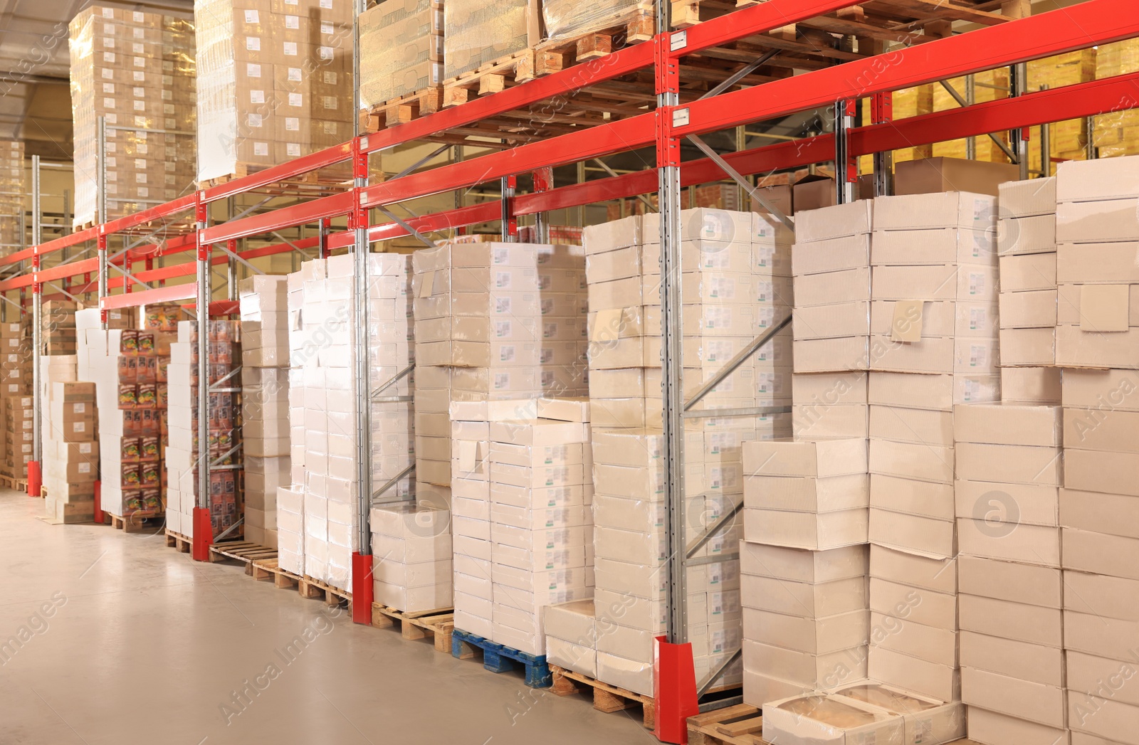 Image of Warehouse with lots of boxes on racks. Wholesale business