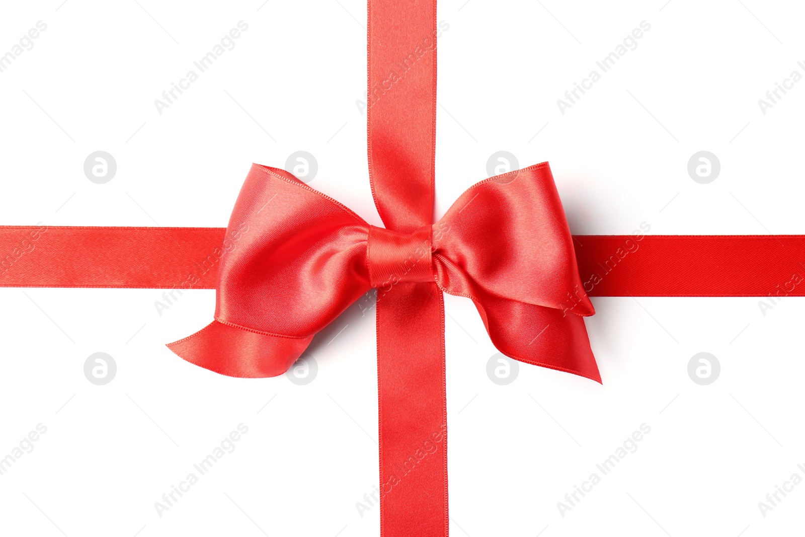 Photo of Red ribbon with bow on white background. Festive decoration