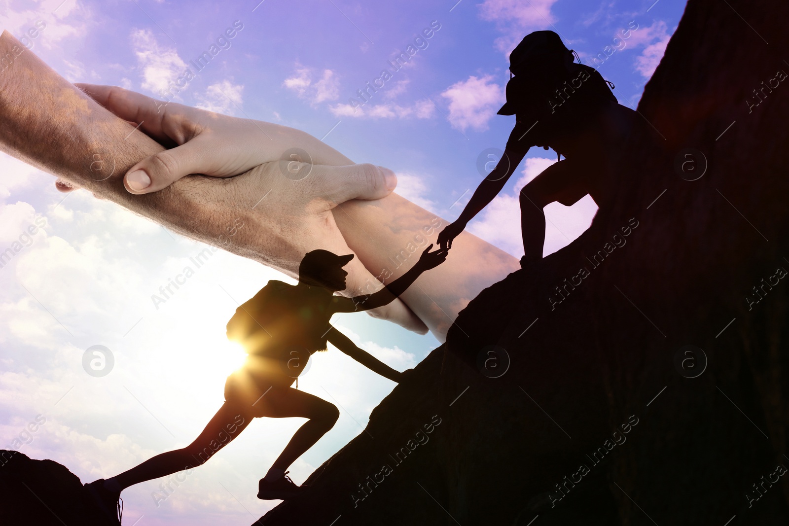 Image of Double exposure of people climbing up mountain and helping hand