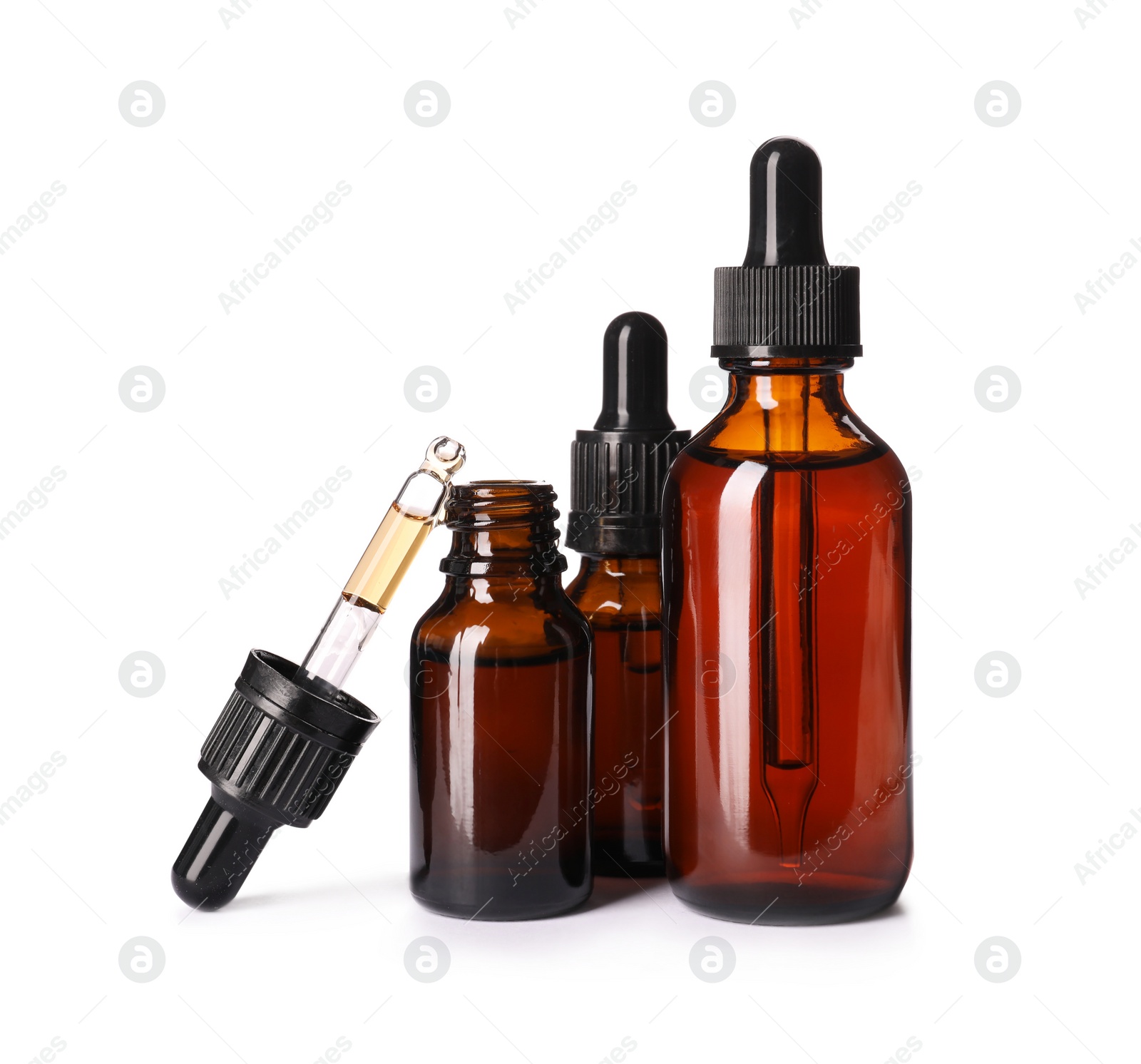 Photo of Cosmetic bottles of essential oils on white background