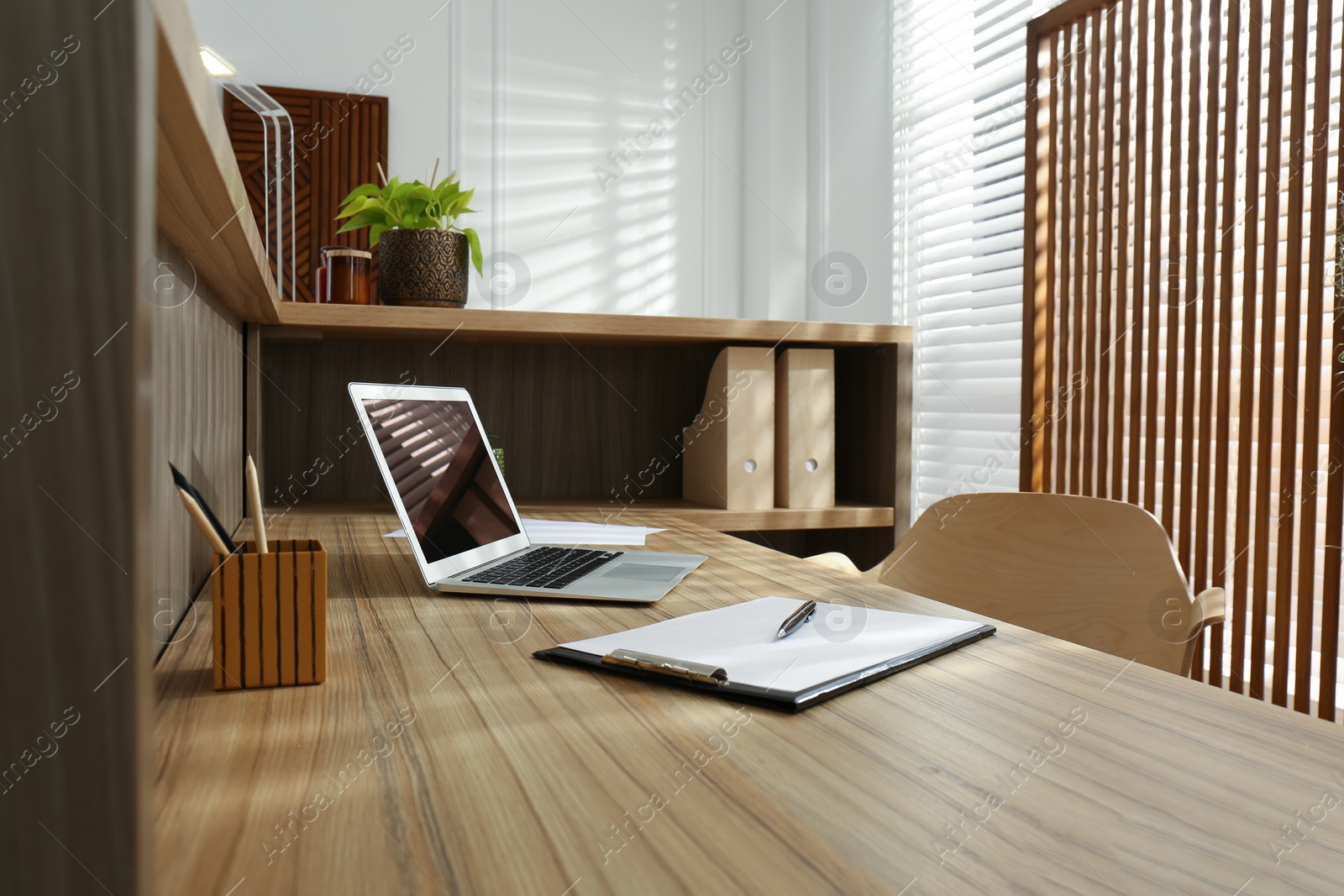 Photo of Receptionist's workplace with laptop in hotel. Interior design