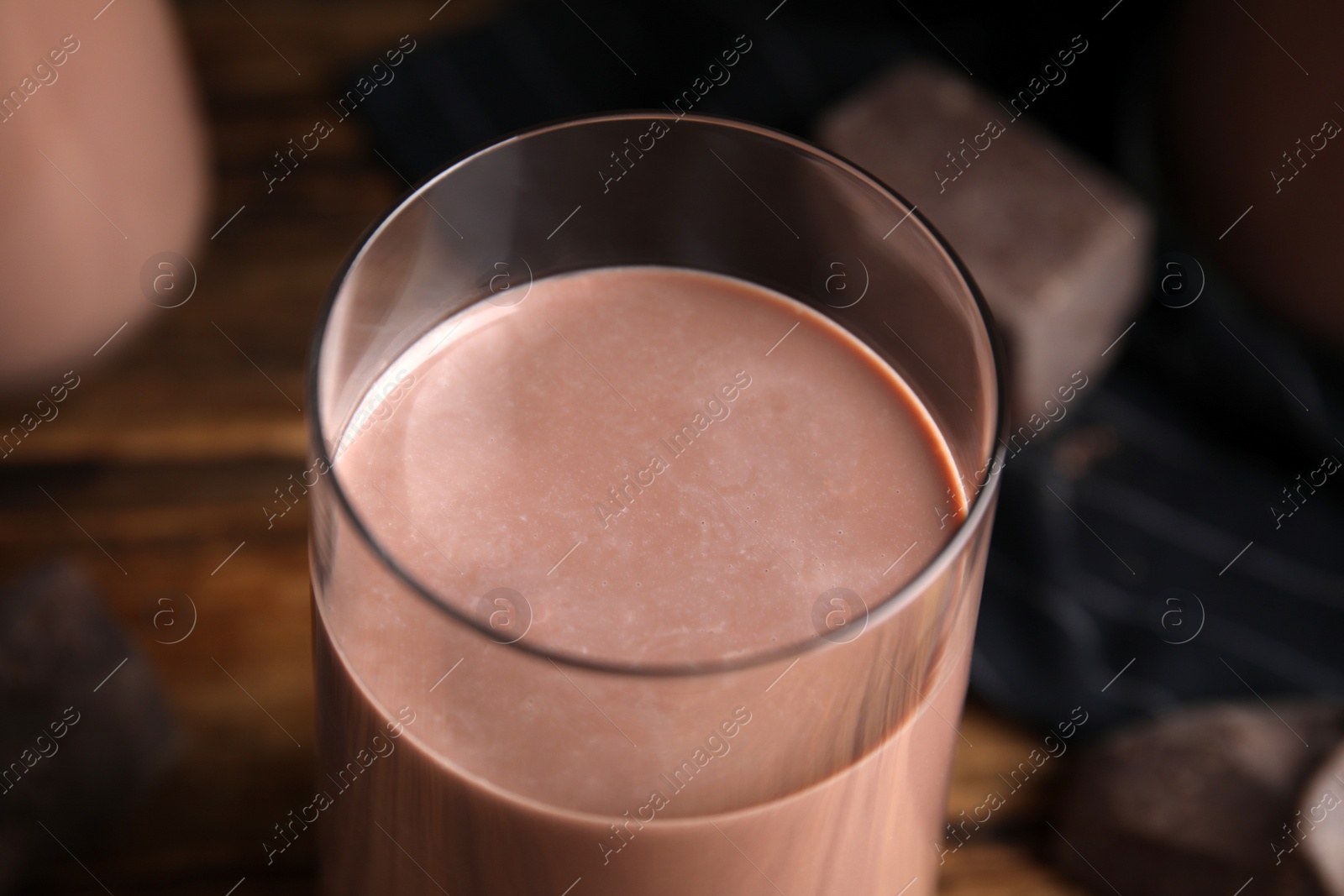 Photo of Delicious chocolate milk in glass, closeup view