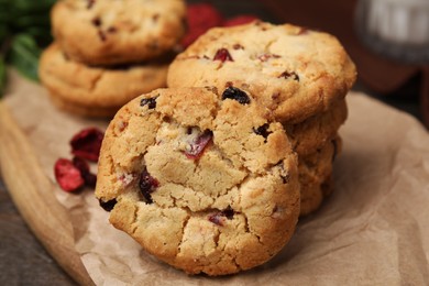Photo of Cookies with freeze dried fruits on wooden table, closeup