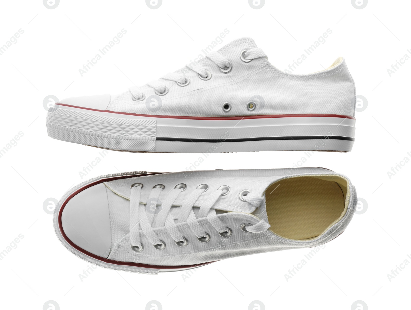 Photo of Pair of trendy sneakers isolated on white, top view