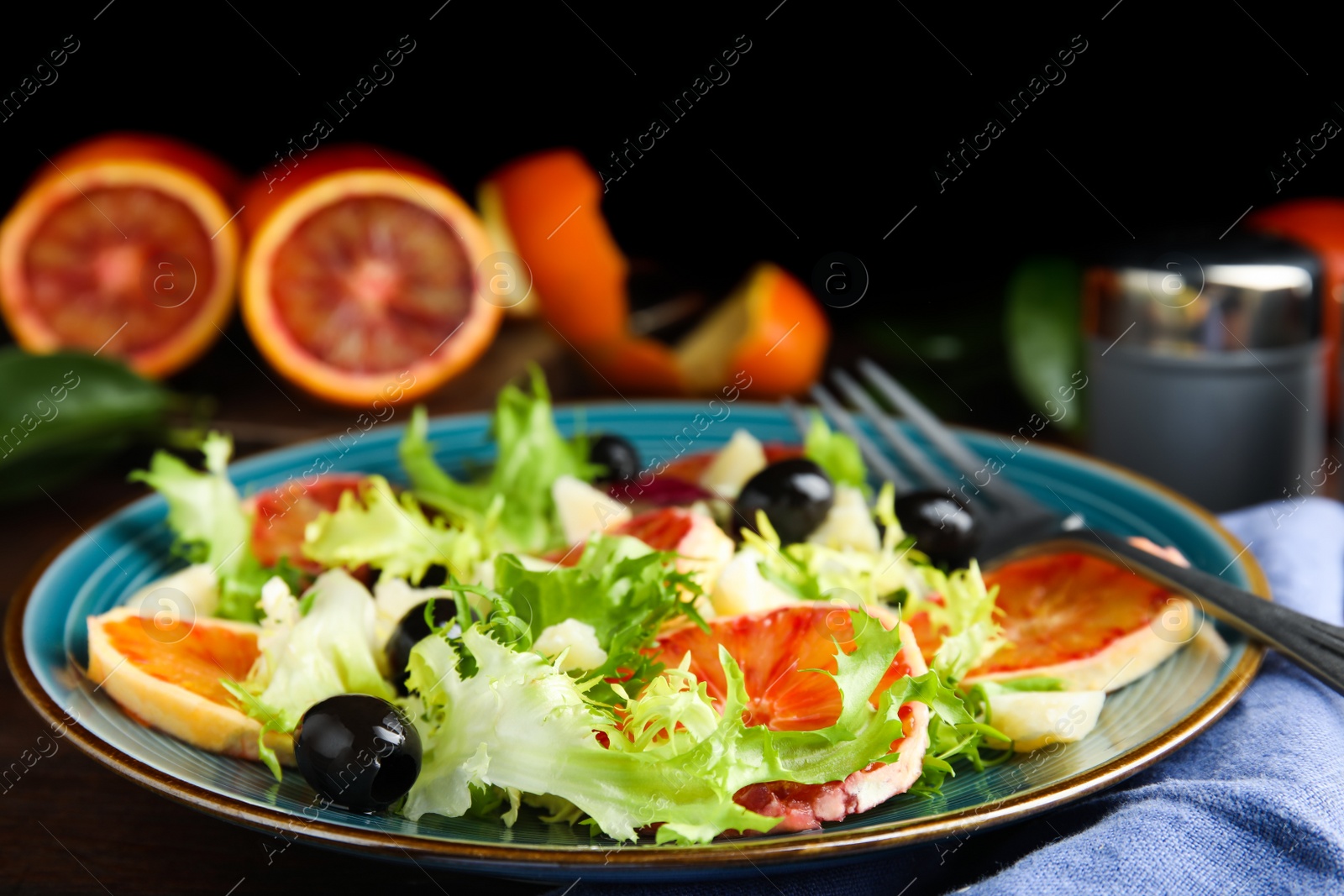 Photo of Plate of delicious sicilian orange salad on table, closeup. Space for text