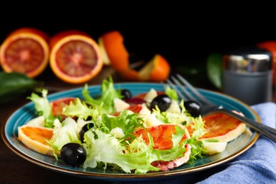 Photo of Plate of delicious sicilian orange salad on table, closeup. Space for text