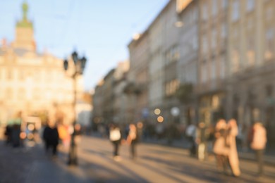 Blurred view of people walking on city street