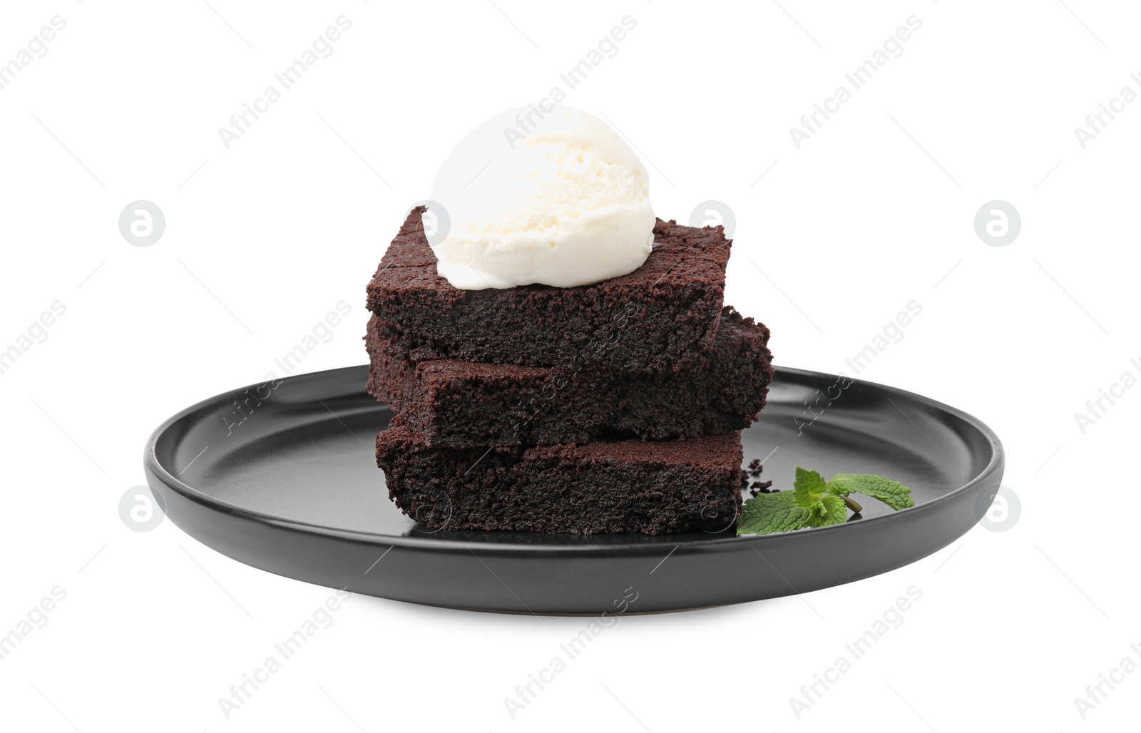 Photo of Tasty brownies with ice cream and mint isolated on white