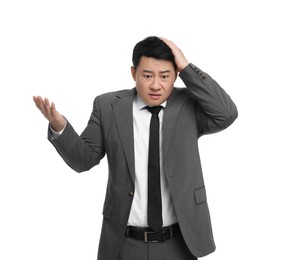 Photo of Confused businessman in suit posing on white background