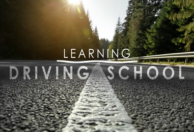 Image of Driving school concept. Closeup view of asphalt road surrounded by forest on sunny day