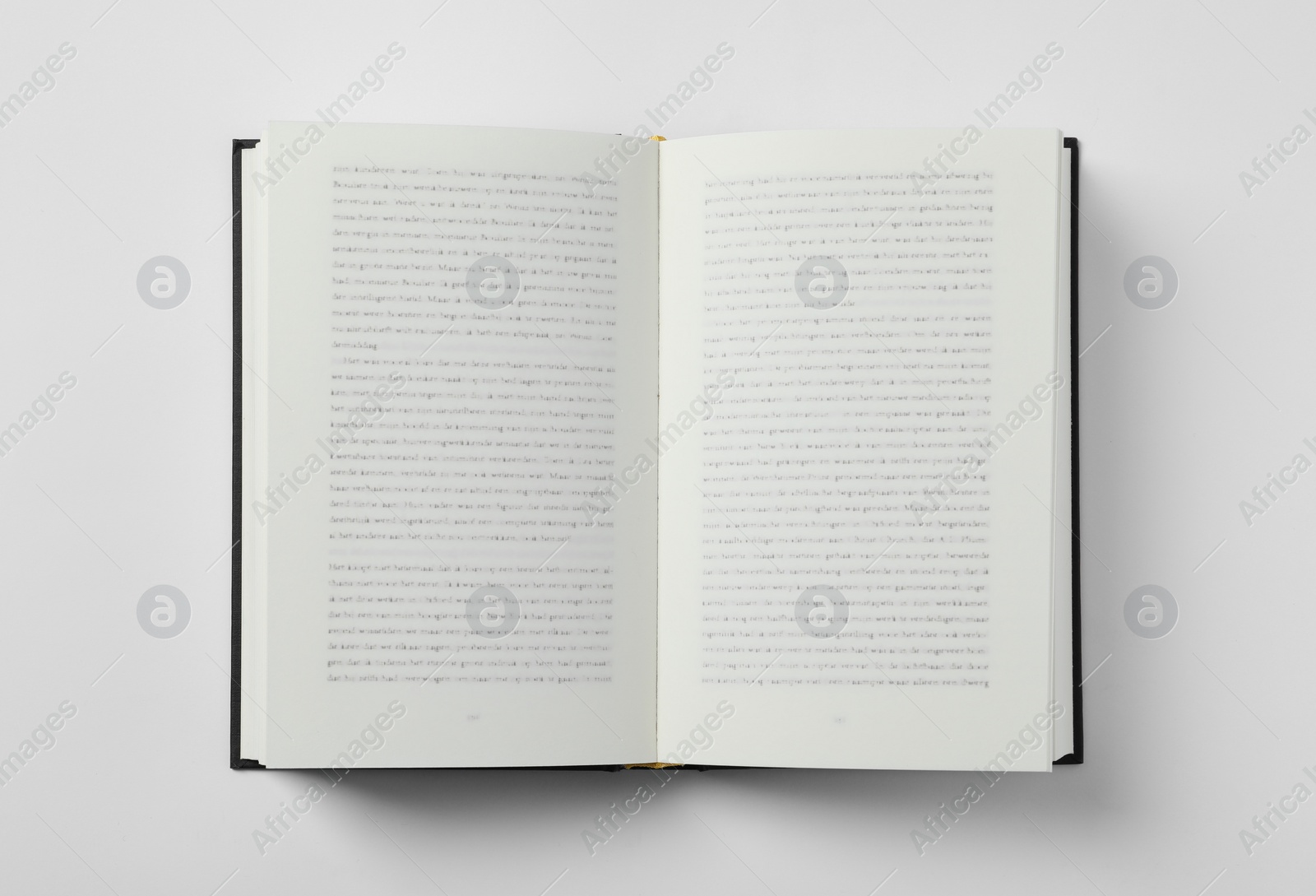 Photo of Open book on white background, top view