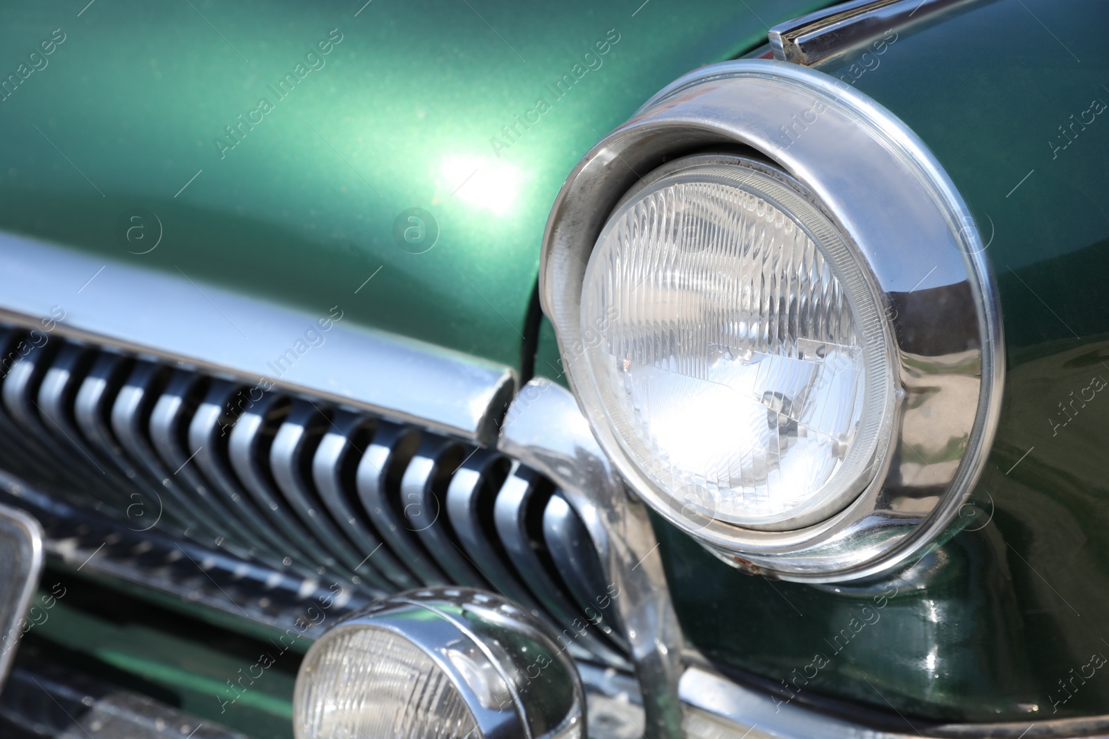 Photo of Closeup view of beautiful green retro car