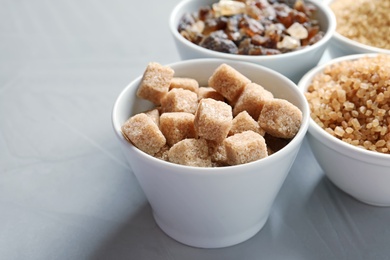 Bowl with  brown sugar on table