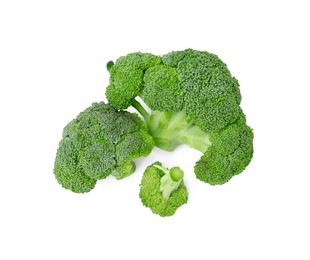 Photo of Fresh raw green broccoli isolated on white, top view