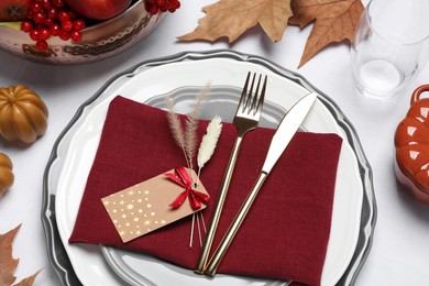 Photo of Elegant festive setting with autumn decor on table