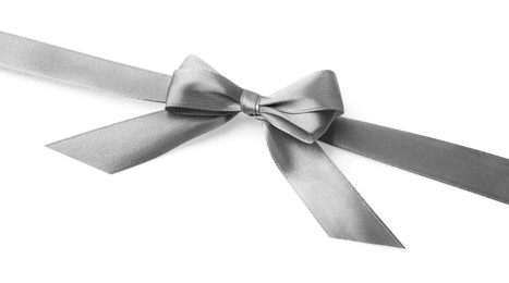 Photo of Grey satin ribbon with bow on white background