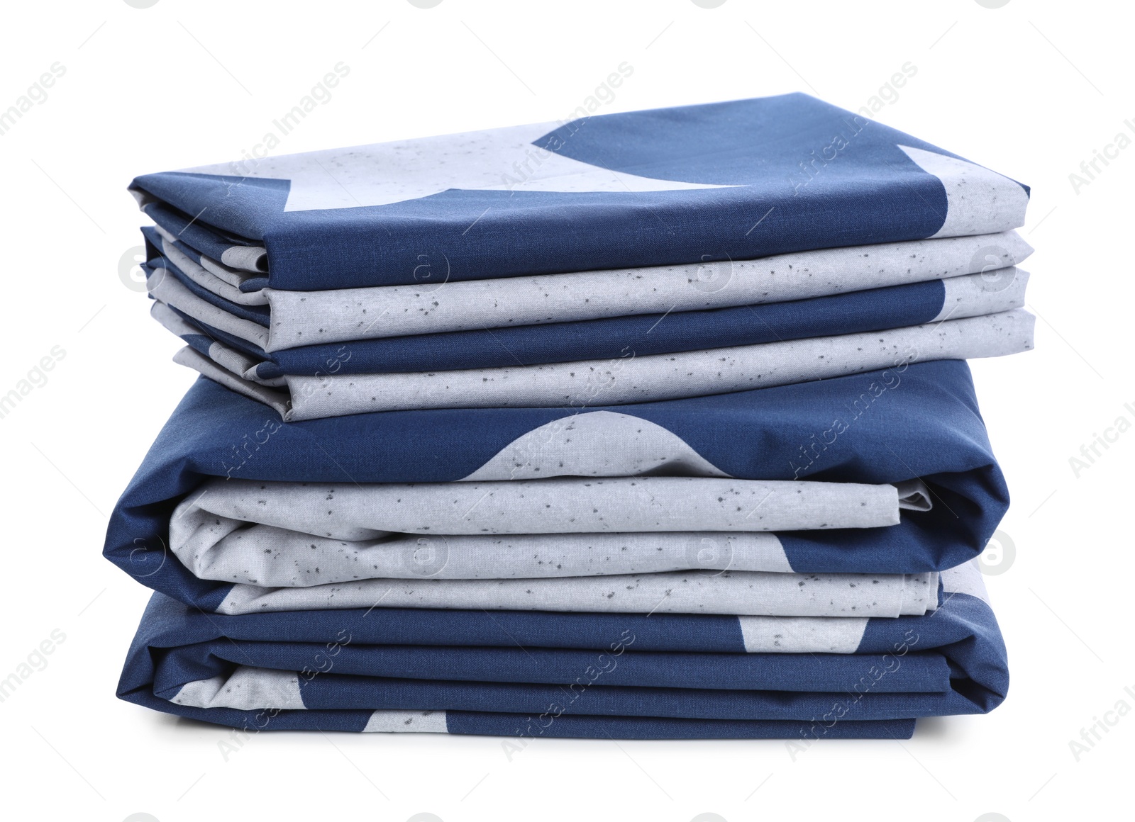 Photo of Stack of clean bed linens isolated on white. Child's room interior element