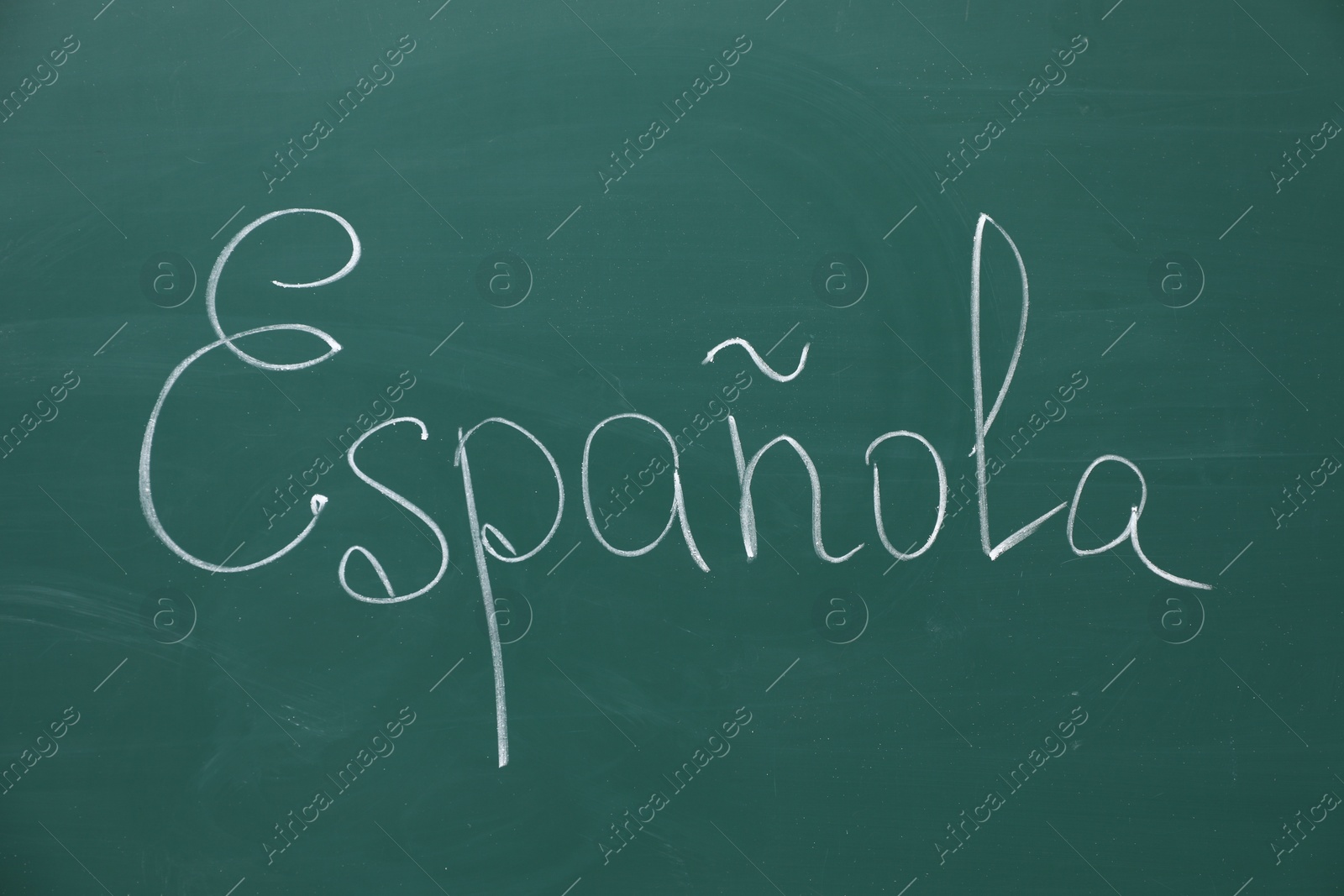 Photo of Word Espanola written with chalk on green board