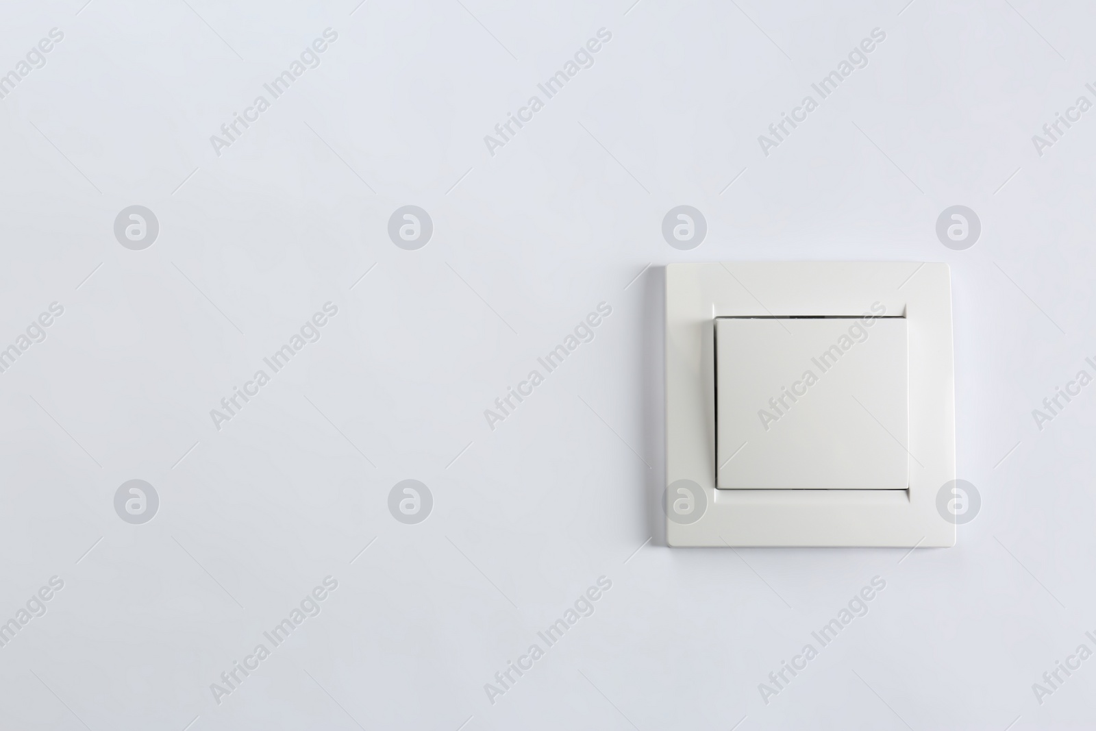 Photo of Light switch on white background. Electrician's equipment