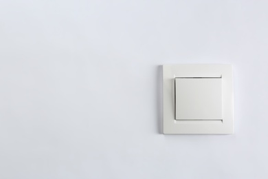 Light switch on white background. Electrician's equipment