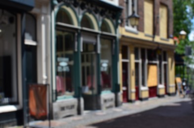 Photo of Blurred view of city street with beautiful buildings