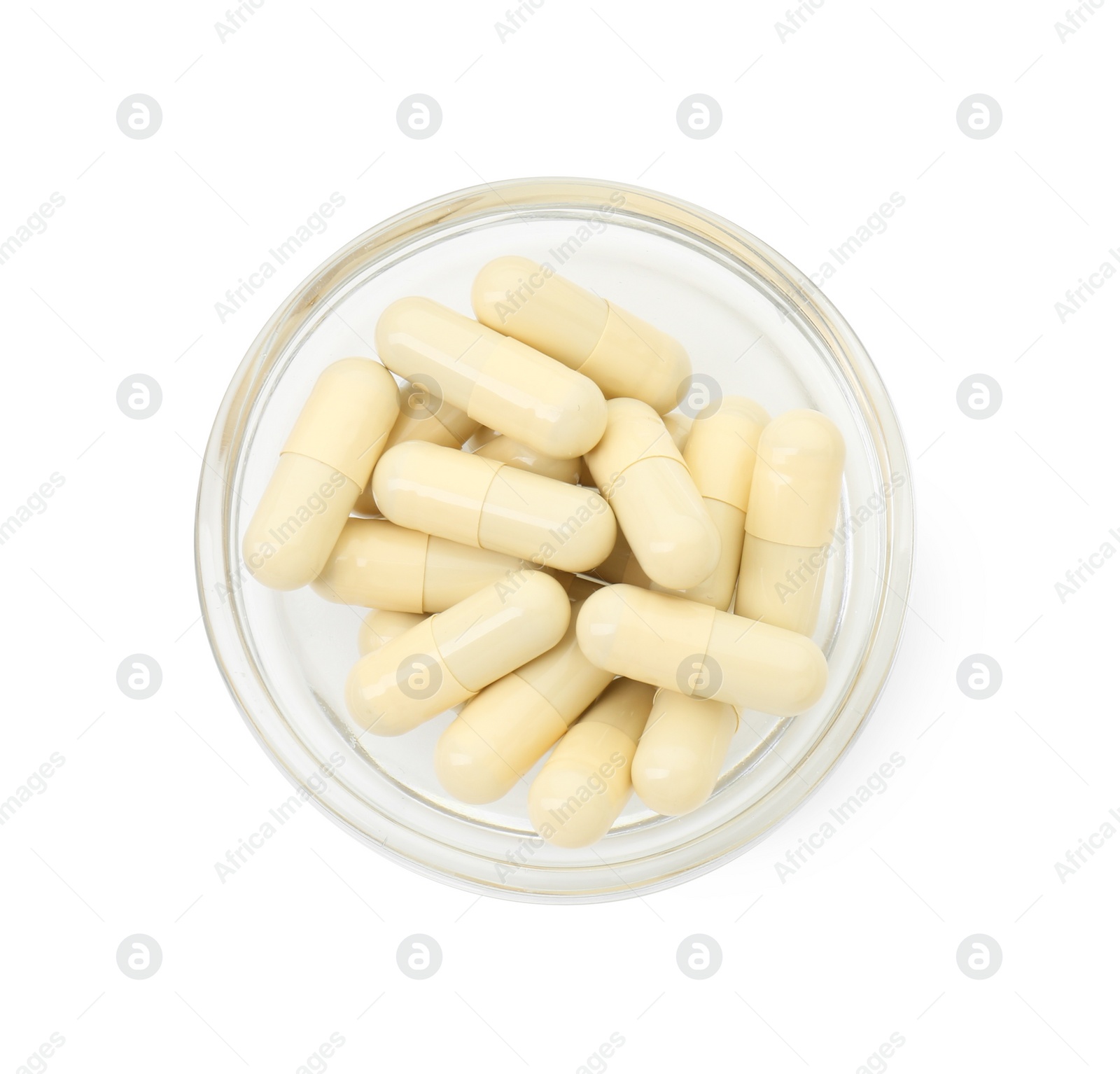 Photo of Vitamin capsules in bowl isolated on white, top view. Health supplement