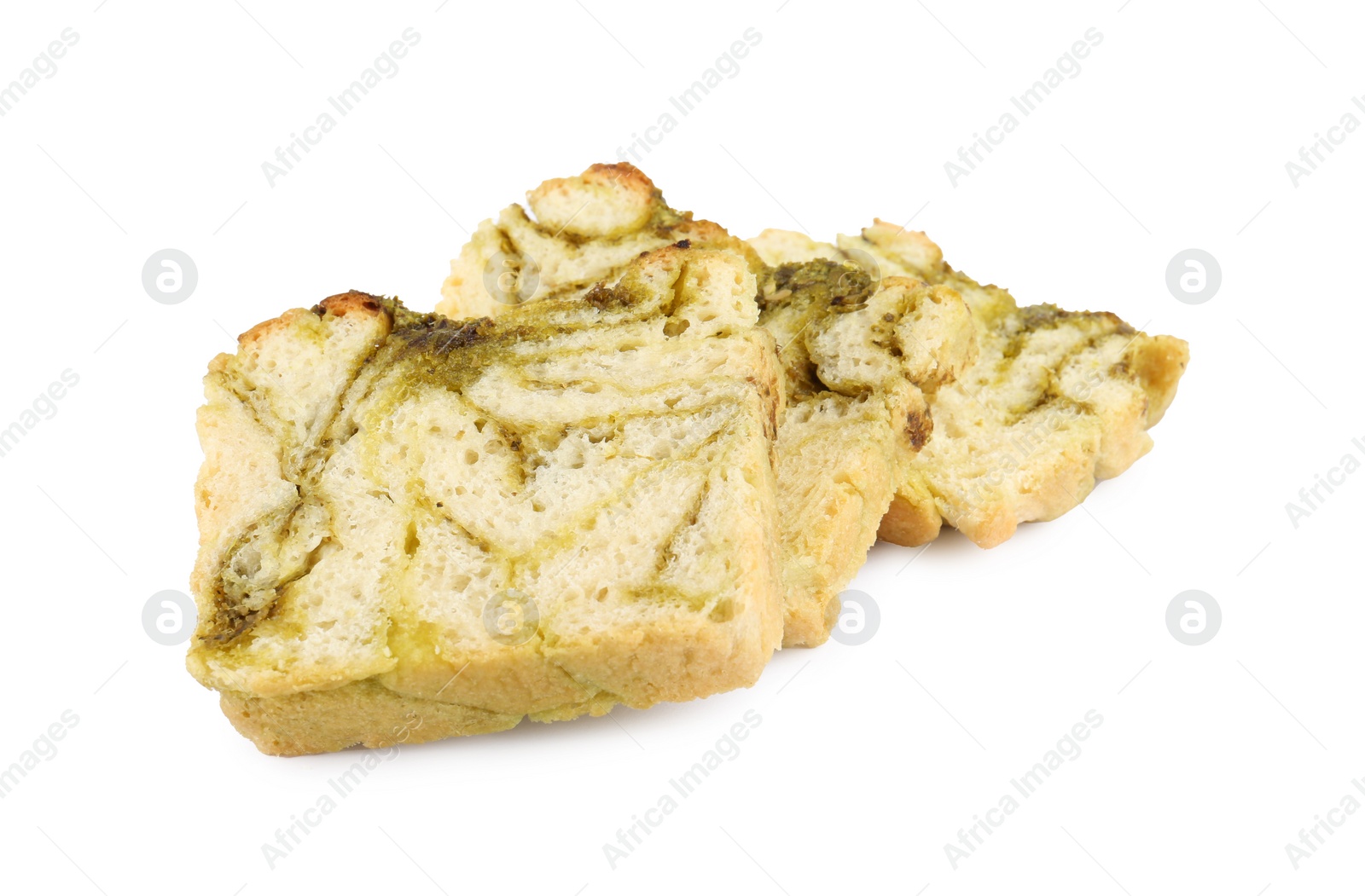 Photo of Slices of freshly baked pesto bread isolated on white