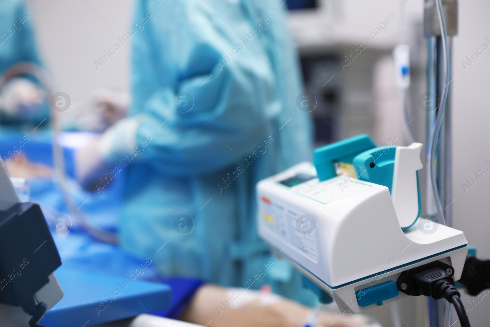 Photo of Medical equipment and blurred doctors in surgery room