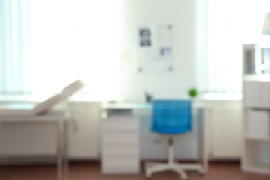 Photo of Blurred view of modern medical office. Doctor's workplace