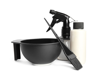 Photo of Professional tools for hair dyeing on white background