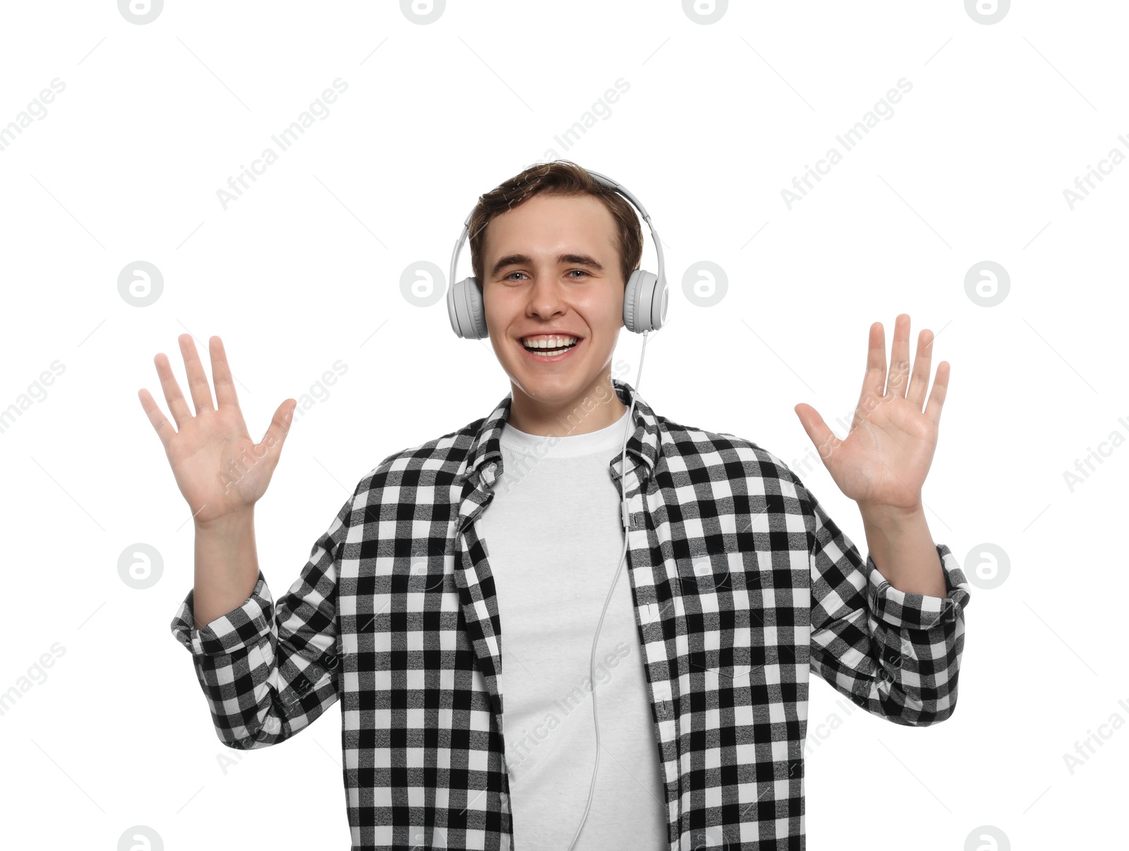 Photo of Handsome young man with headphones on white background