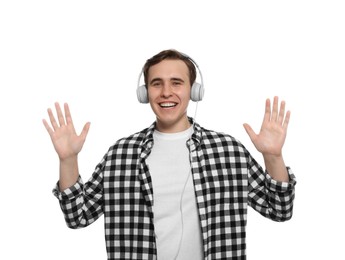 Handsome young man with headphones on white background