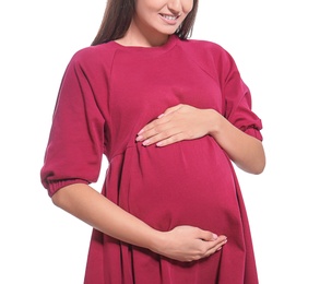 Young pregnant woman in casual clothes on white background