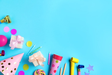 Photo of Flat lay composition with different birthday party items on light blue background, space for text