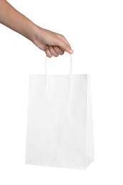 Photo of Woman holding shopping paper bag on white background