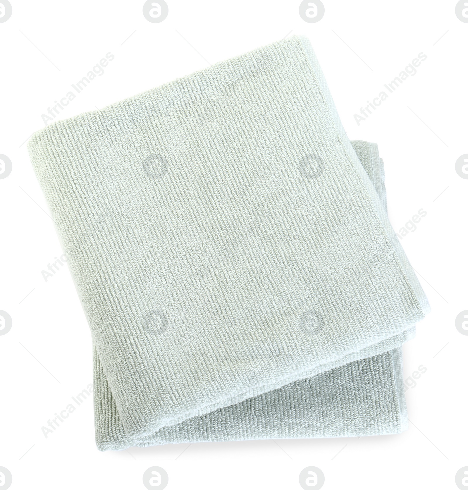 Photo of Soft folded towels isolated on white, top view