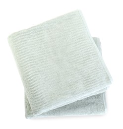 Photo of Soft folded towels isolated on white, top view