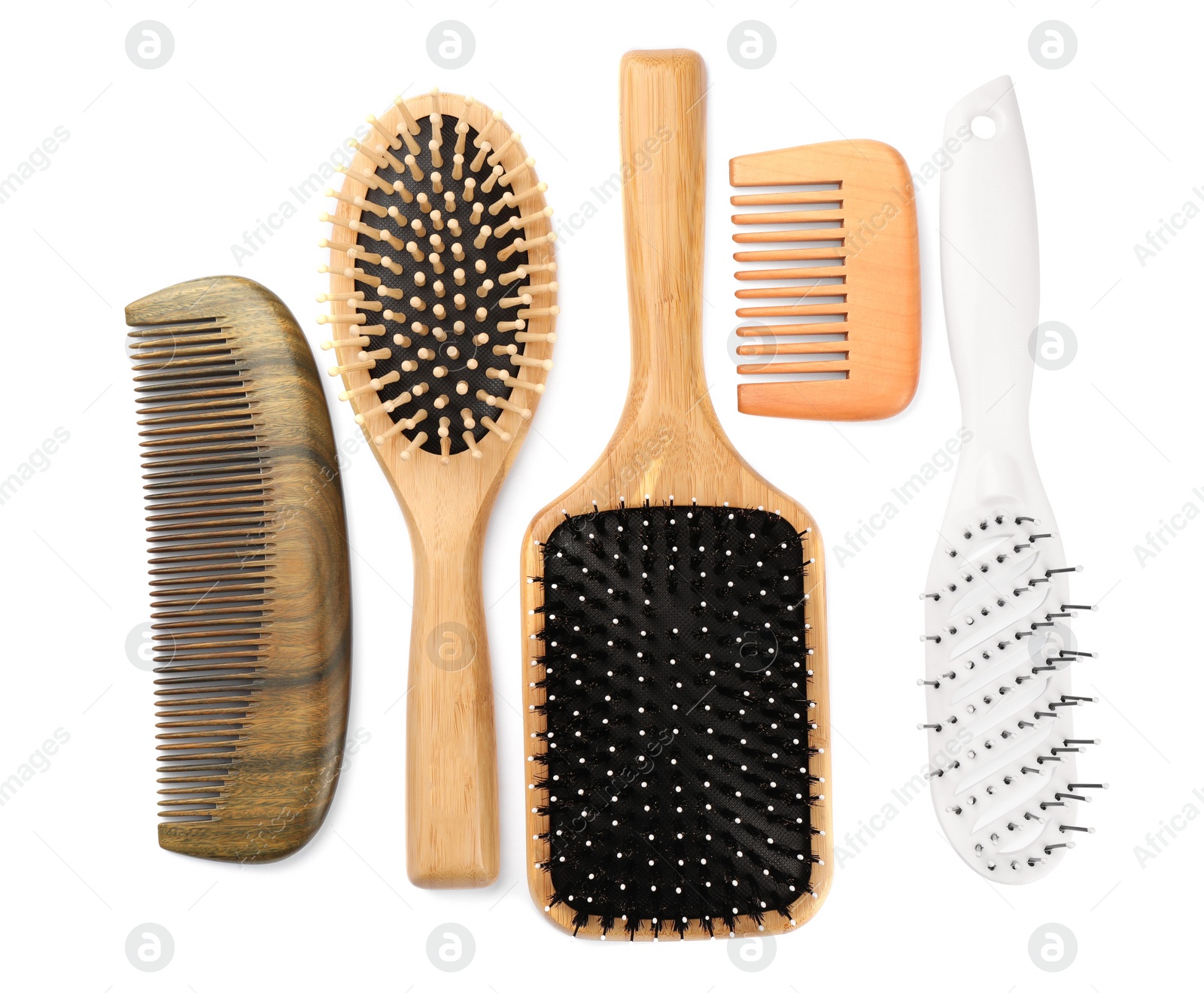 Photo of Set of hair brushes and combs isolated on white, top view