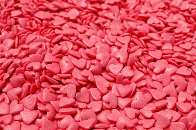 Sweet candy hearts as background, closeup view