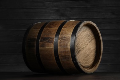 Photo of One wooden barrel on table near wall, closeup