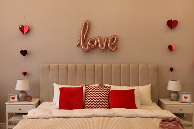 Photo of Cozy bedroom decorated for Valentine Day. Interior design