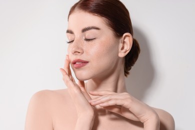 Photo of Portrait of beautiful woman on light background, closeup