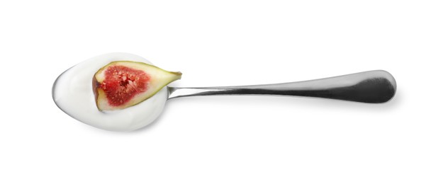 Photo of Spoon with yogurt and fig isolated on white
