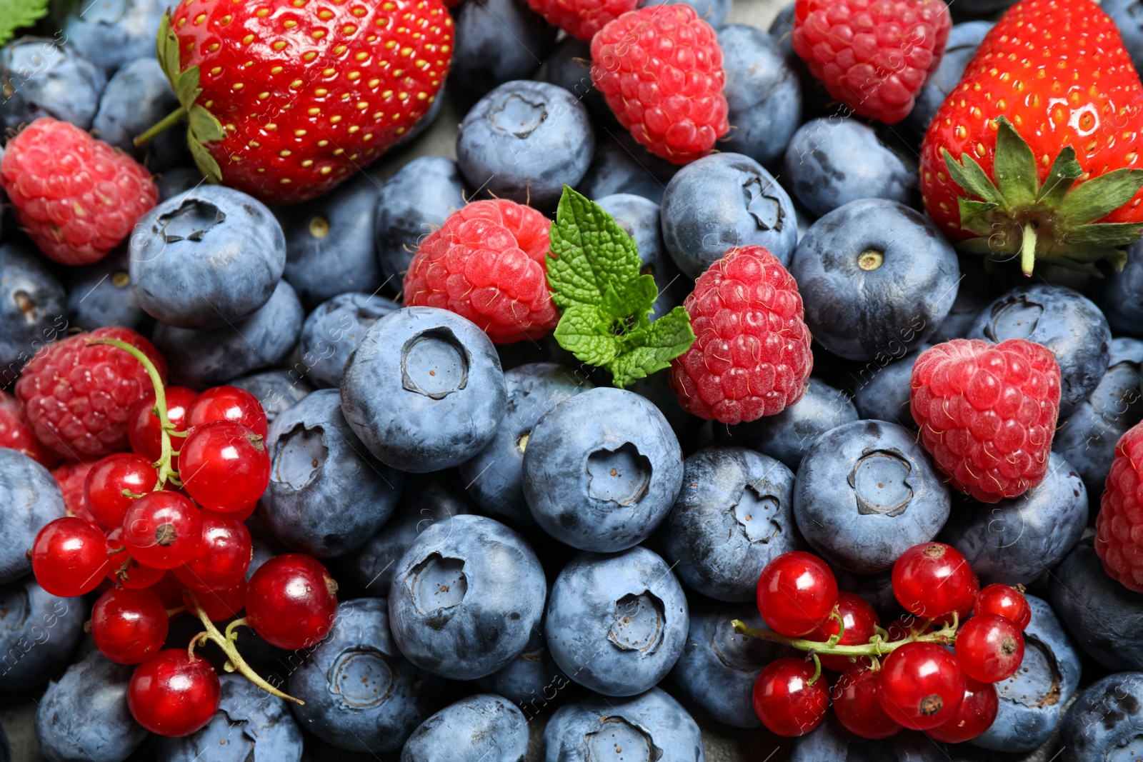 Photo of Mix of fresh delicious berries as background, top view