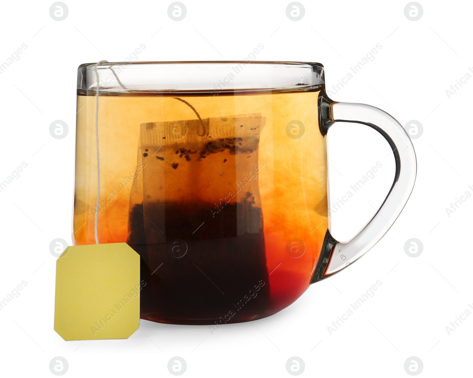 Photo of Tea bag in glass cup of hot water isolated on white