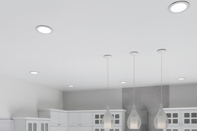 White ceiling with modern lighting in room