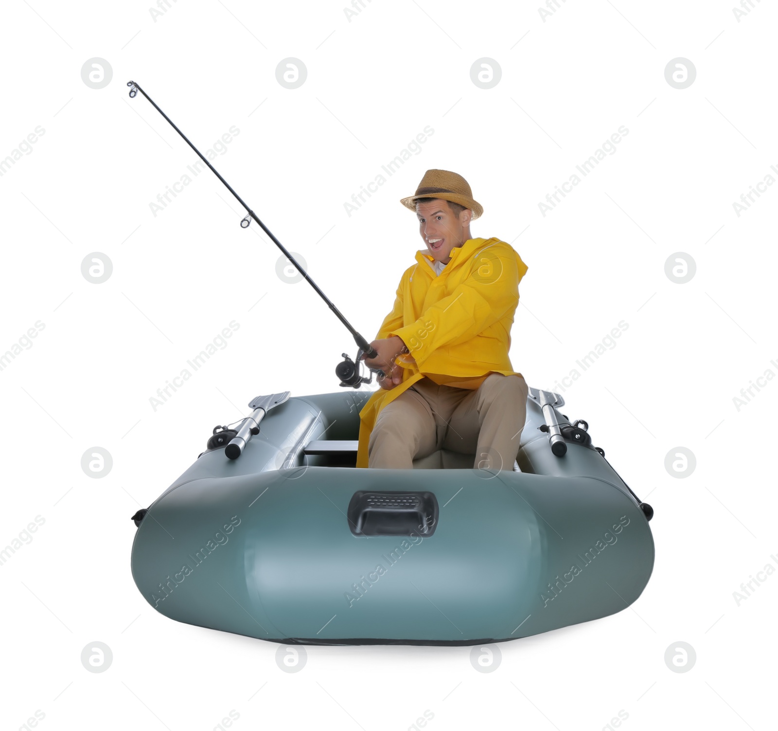 Photo of Man fishing with rod from inflatable rubber boat on white background