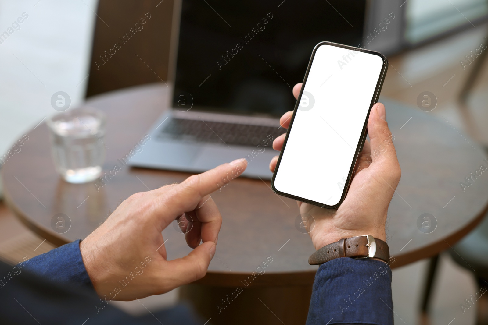 Photo of Man using mobile phone indoors, closeup. Space for text