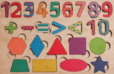 Wooden math game kit for children as background, top view