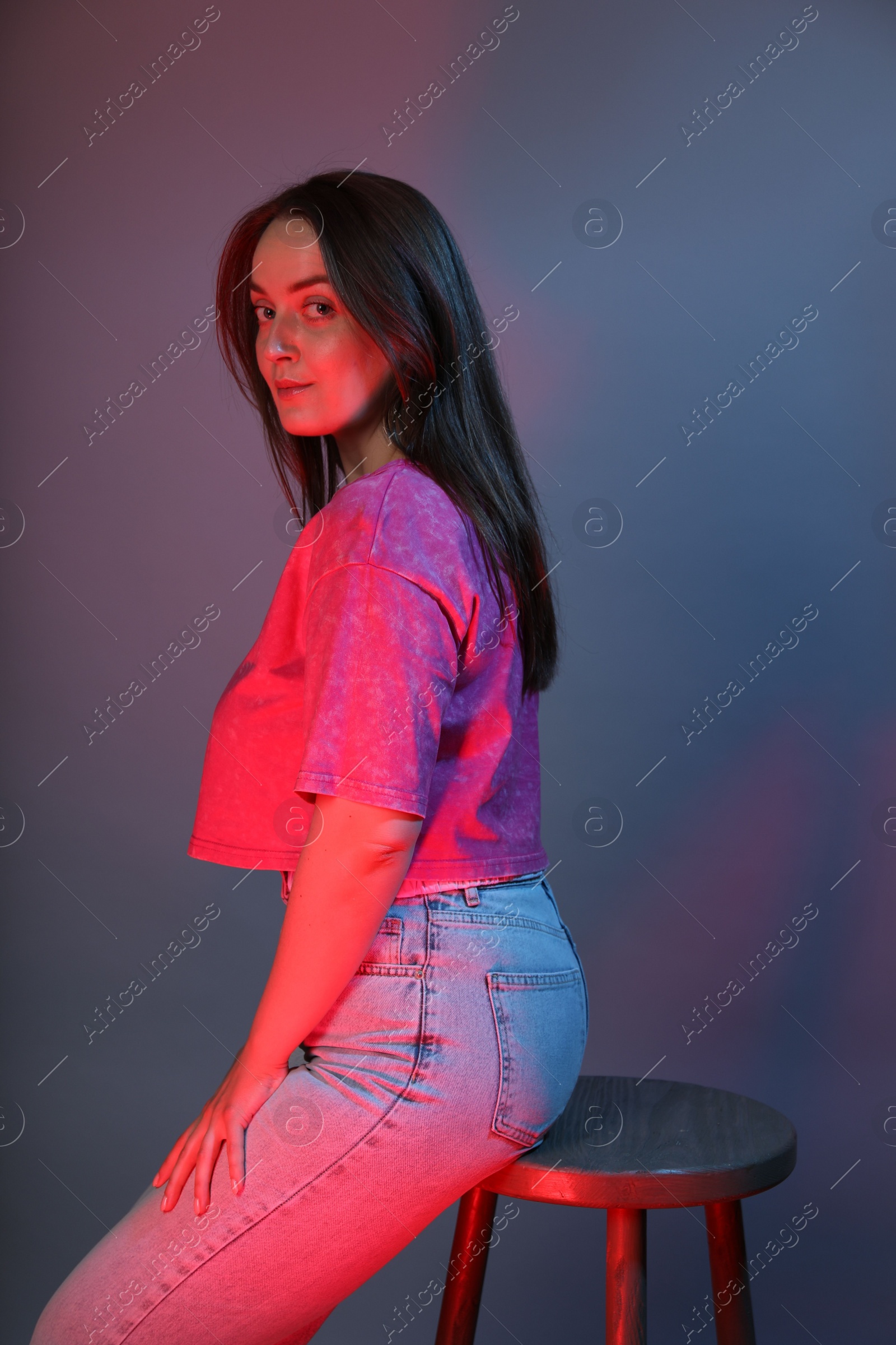 Photo of Portrait of beautiful woman on color background